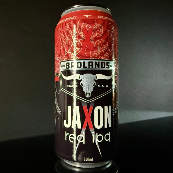 A can of Badlands Brewery, Jaxon Red IPA, 440ml from My Beer Dealer. It is a red and black design with a cow skull logo on it.