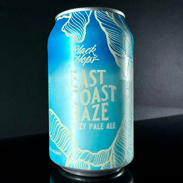 Blue and white beer can labeled 'East Coast Haze' by Black Hops on a dark background from My Beer Dealer.