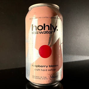 A can of Hohly Water, Raspberry Bloom Hard Seltzer on a dark background. 
