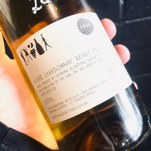 Back label of a bottle of Commune of Buttons, Estate Chardonnay Basket Range
